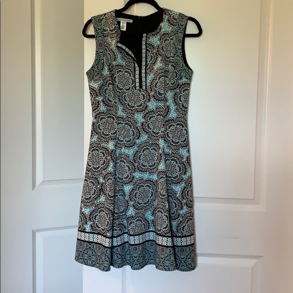 Sleeveless teal and black patterned dress